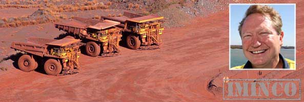Fortescue Pilbara mining operations - dump trucks on iron ore mine site - iMINCO