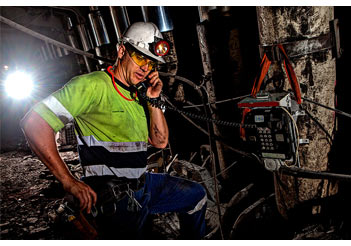 mining coal underground man supervisor on phone iMINCO Mining