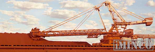 Roy Hill iron ore mine. Gina Reihnart, mining jobs creation. Image of an iron ore loader. iMINCO Mining Information.