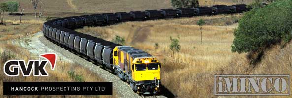 Transporting coal by rail. Hancock coal GVK Group Gina Rinehart deal for Australian coal mining workers.