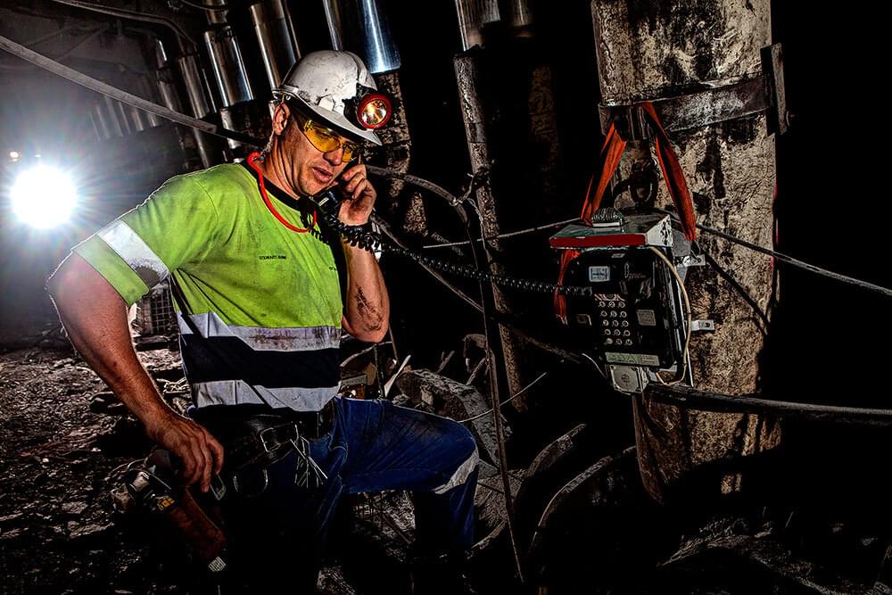 mining underground worker on phone
